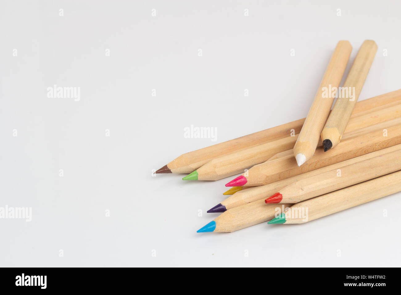 Colored pencils lies on a white background Stock Photo