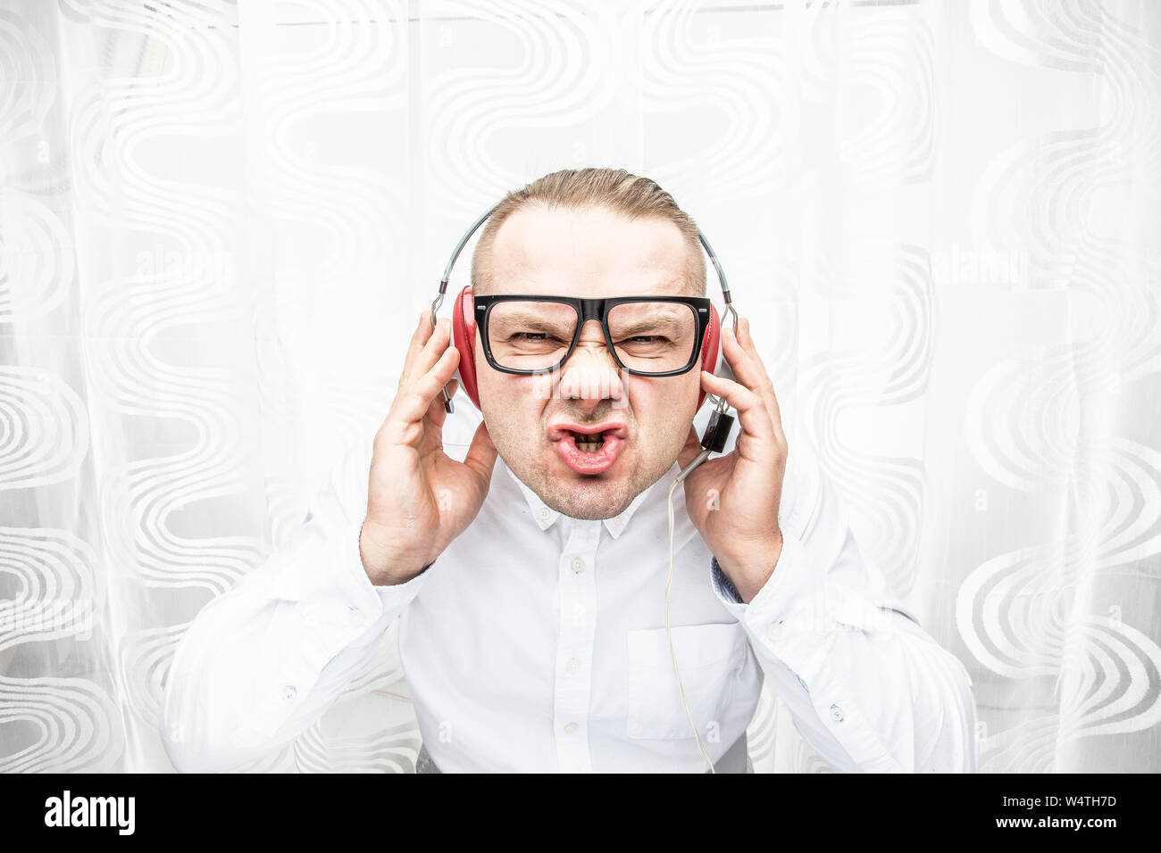 Man enjoys loud music in the headphones Stock Photo Alamy