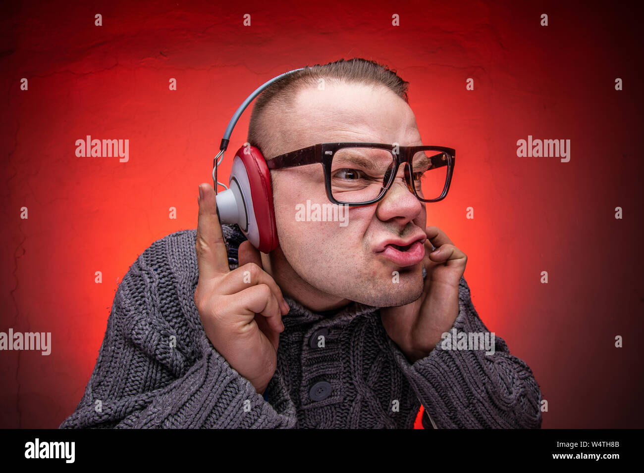 Man enjoys loud music in the headphones Stock Photo Alamy