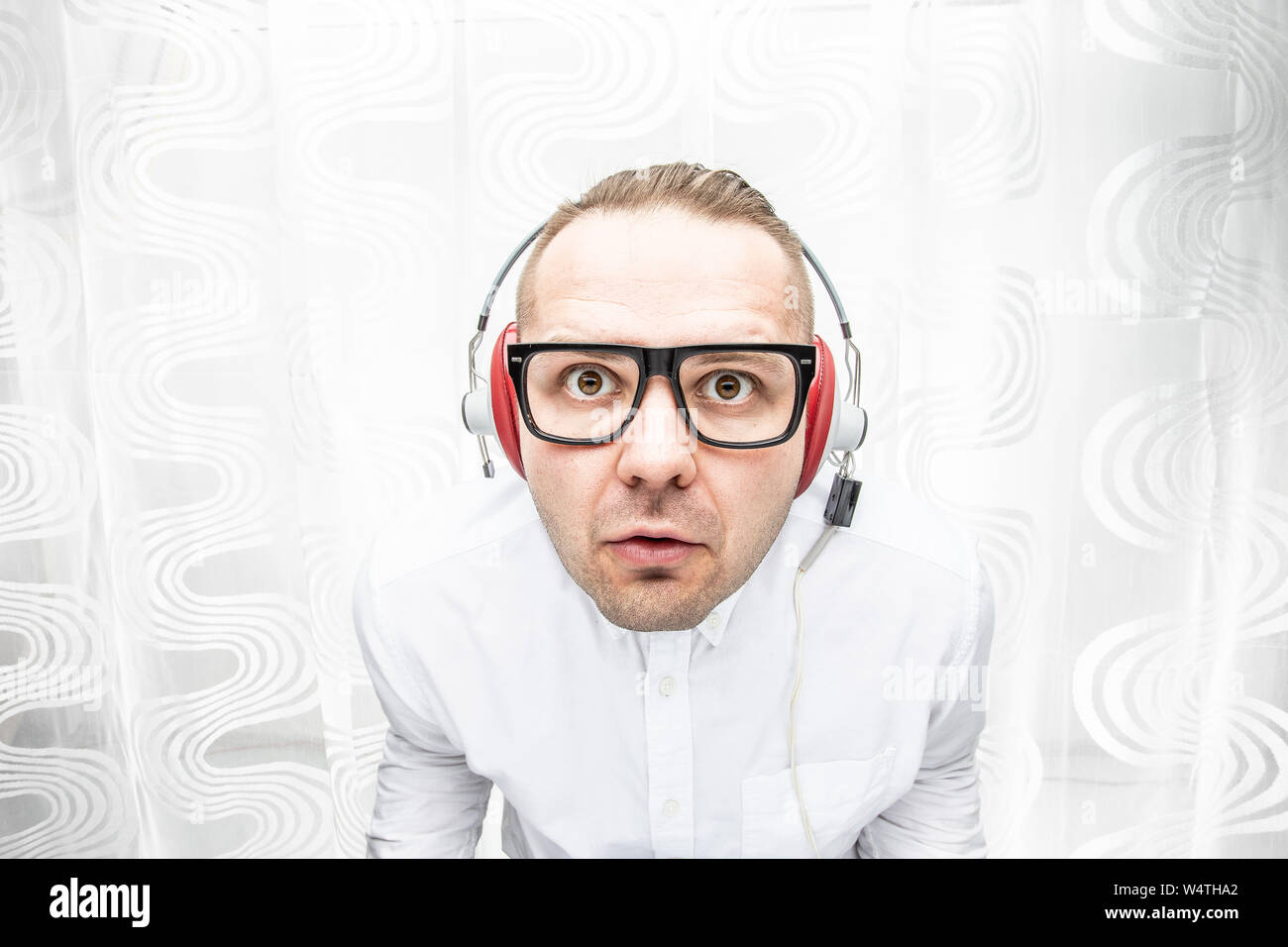 Man enjoys loud music in the headphones Stock Photo Alamy