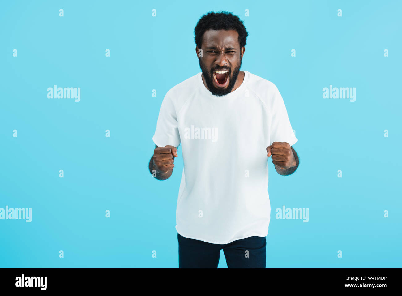 aggressive african american man screaming isolated on blue Stock Photo ...