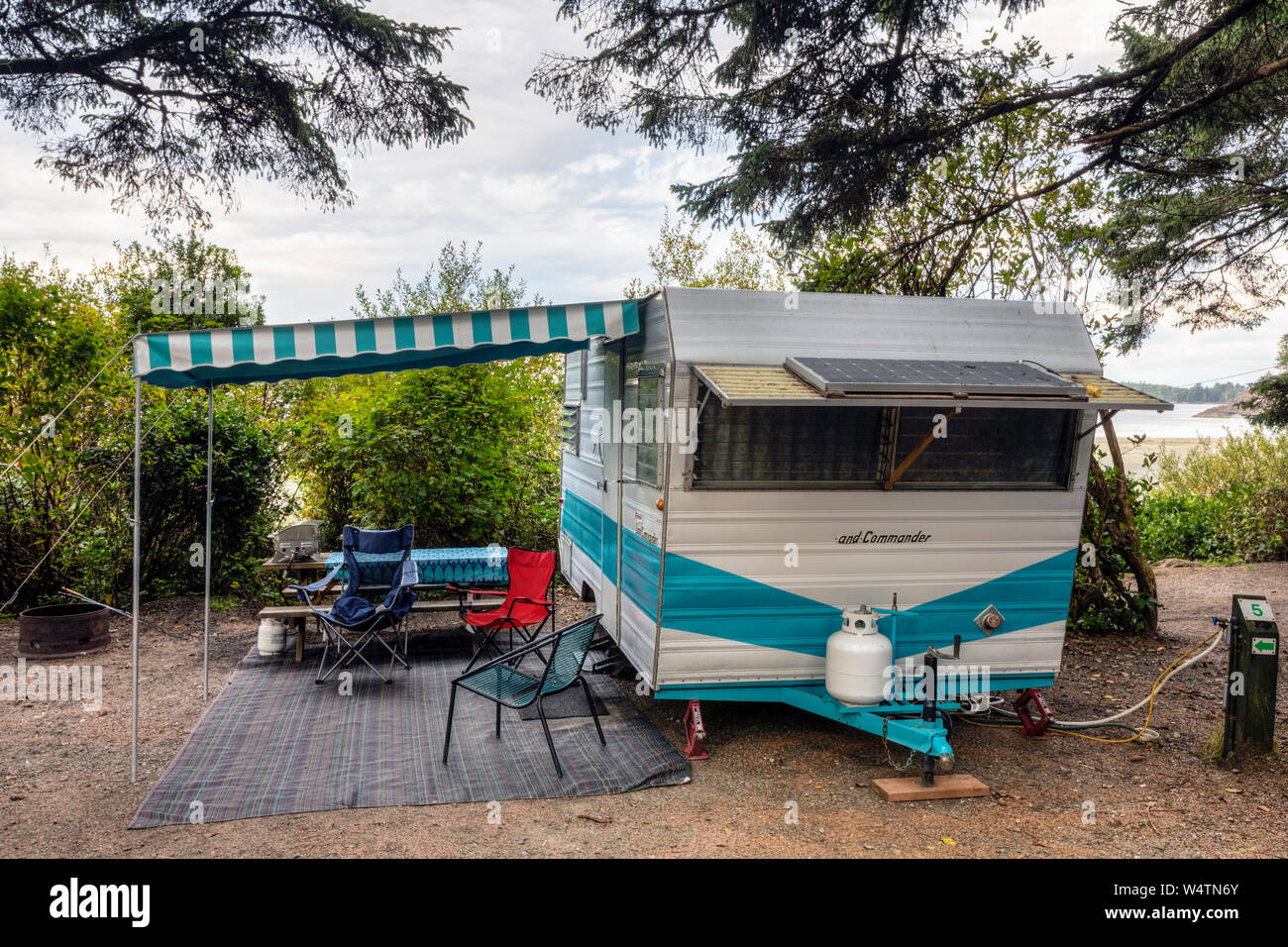 A vintage camping trailer fixed up for glamping on Mckenzie Beach on Vancouver Island. Stock Photo