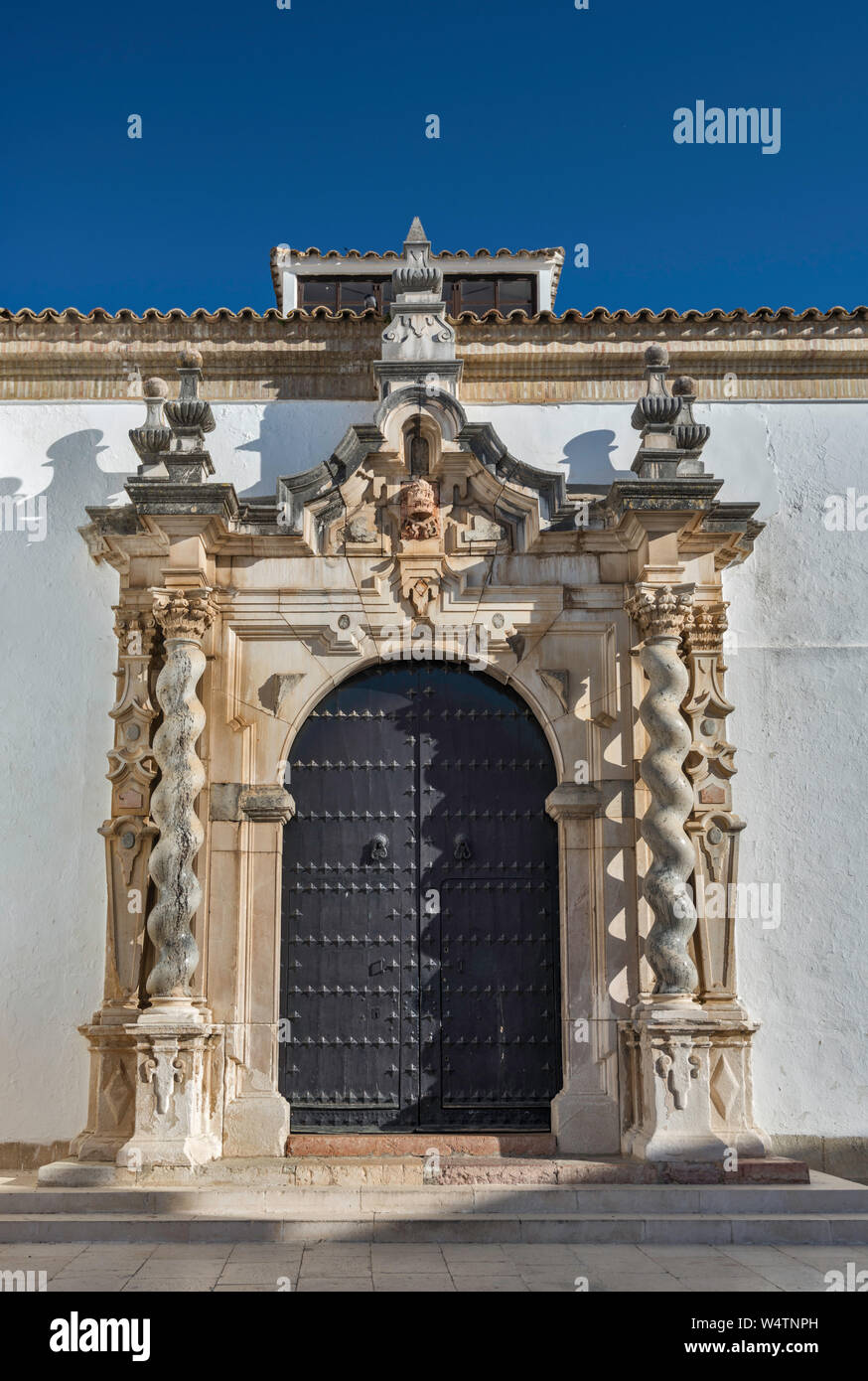 Solomonic columns at Baroque portal at Iglesia de la Asuncion, Assumption Church, in Cabra, Cordoba Province, Andalusia, Spain Stock Photo