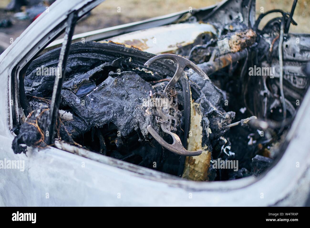 Problem on road. Car after accident with fire. Closeup of burnt