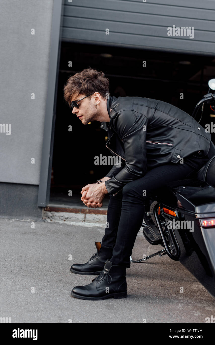 Muscular man in leather jacket hi-res stock photography and images - Alamy