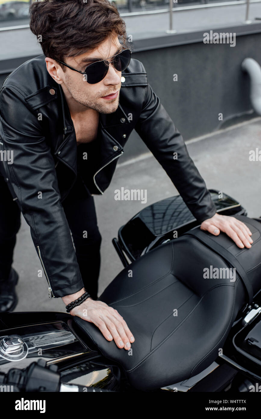 Muscular man in leather jacket hi-res stock photography and images - Alamy
