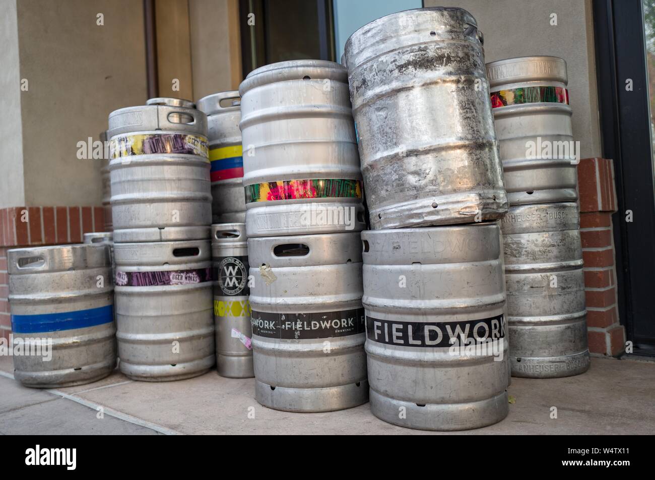 Low-angle view of stack of kegs containing craft brew beer from microbreweries including Fieldwork, in downtown Livermore, California, November 19, 2018. () Stock Photo