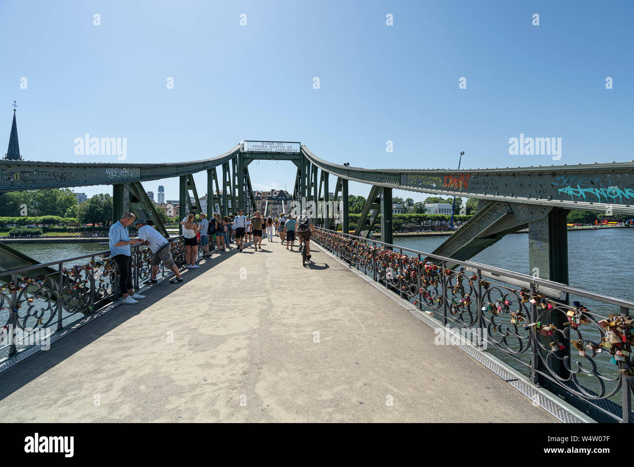 Frankfurt am Main, July 2019. A view of the people walk  on the Iron Bridge Stock Photo