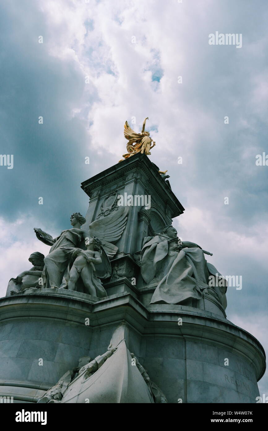 The Victoria Memorial near Buckingham Palace in London, UK photographed against the cloudy sky. Stock Photo