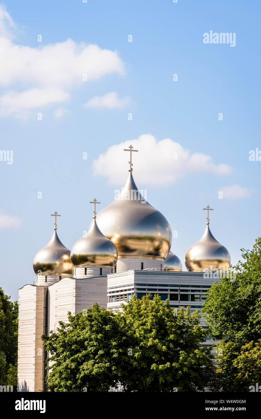 The Holy Trinity Cathedral in Paris, France, is a modern russian Orthodox cathedral, built in 2016 and topped by five golden onion domes. Stock Photo