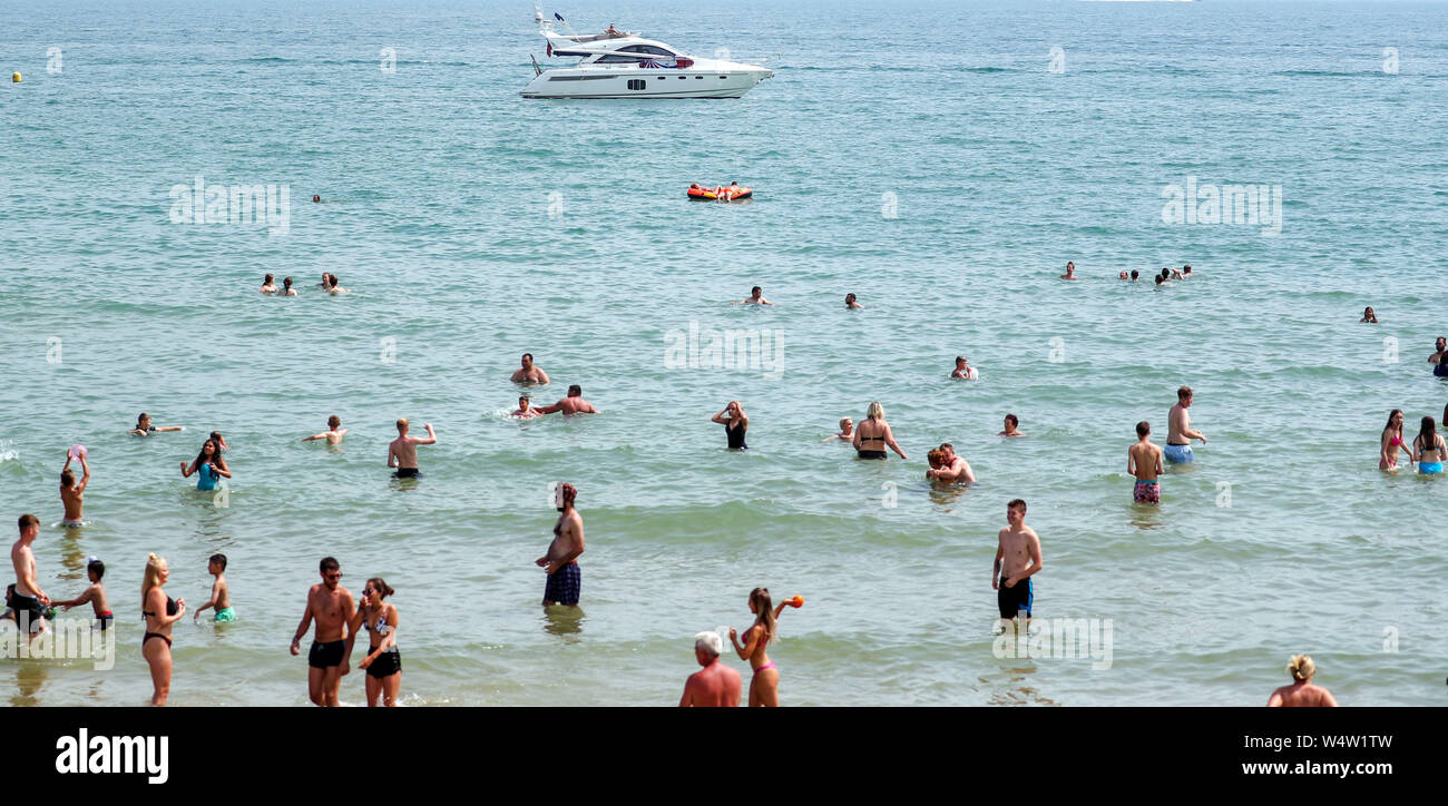 People cool off in the sea at Bournemouth beach as the UK has surpassed the hottest July day on record, with 36.9 degrees celsius being recorded at Heathrow. The all-time UK record of 38.5C (101.3F) recorded in Faversham, Kent, in August 2003, could be broken on Thursday, the Met Office said. Stock Photo