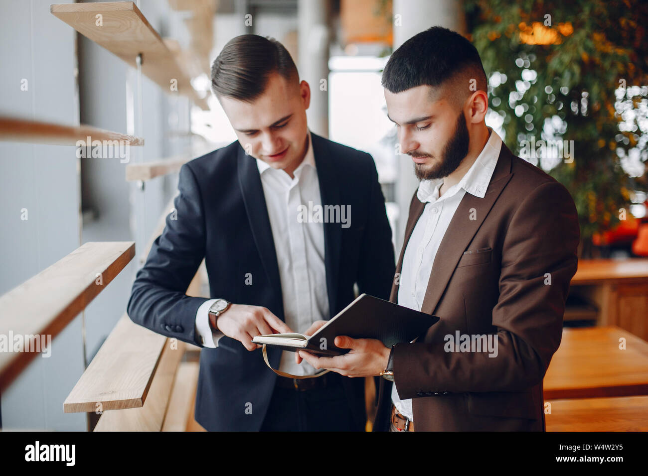 Two businessmen working in a cafe Stock Photo