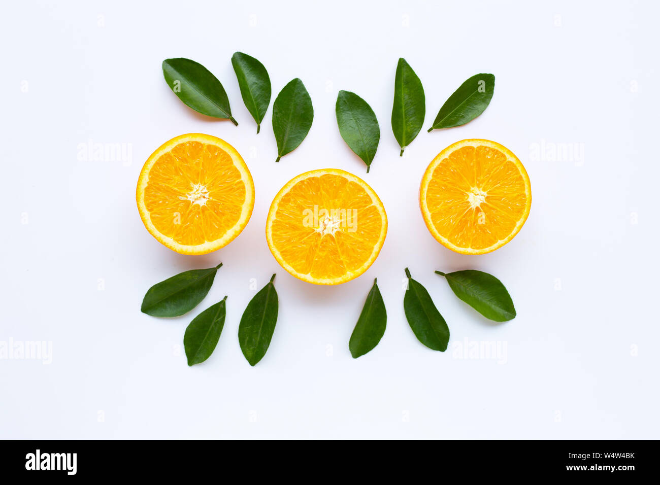 High vitamin C. Fresh orange citrus fruit with leaves isolated on white