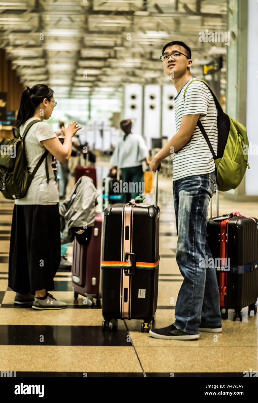 Singapore - April 7,2018: Travellers looking forward to friends or relatives to send them off at T3 Changi International Airport departure hall. Stock Photo