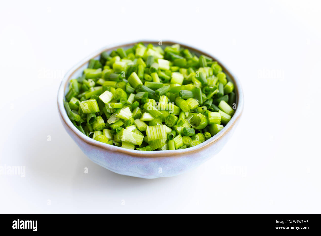 Green onions isolated on white background Stock Photo - Alamy