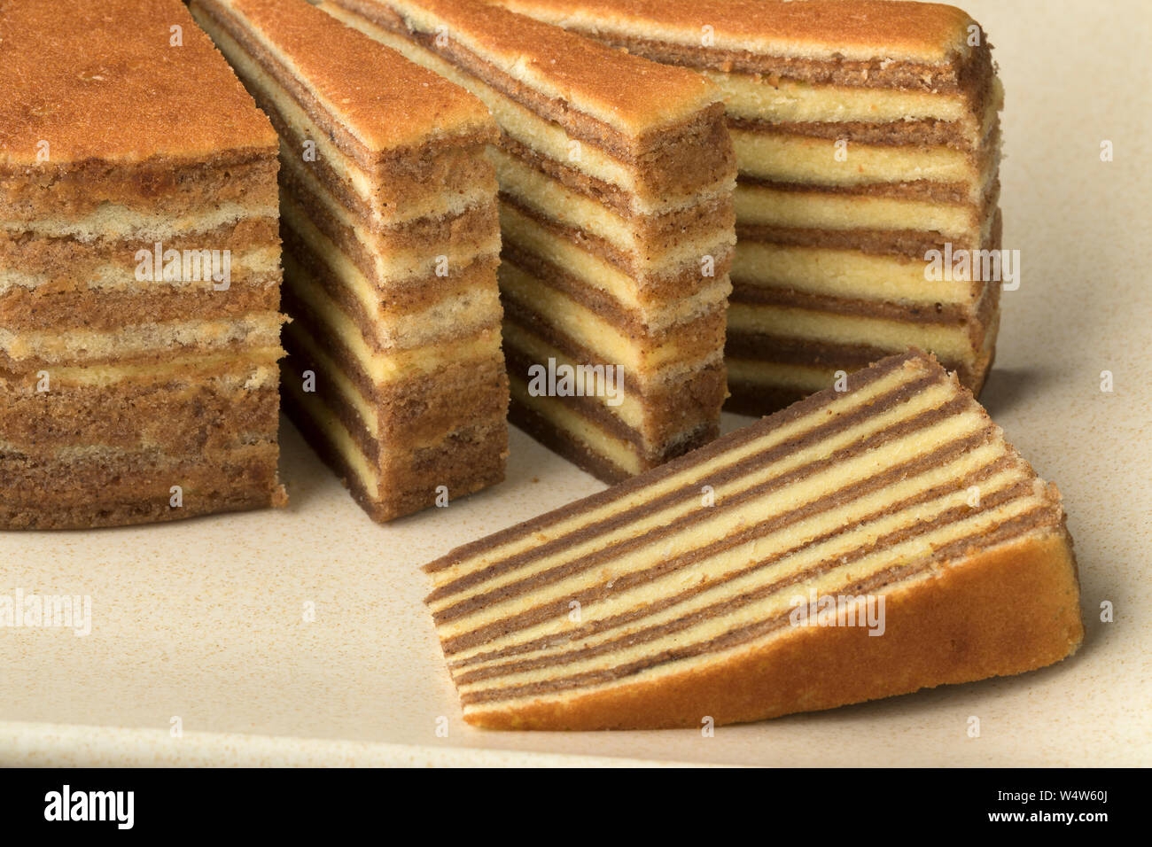 Traditional Asian homemade layer cake and slices Stock Photo