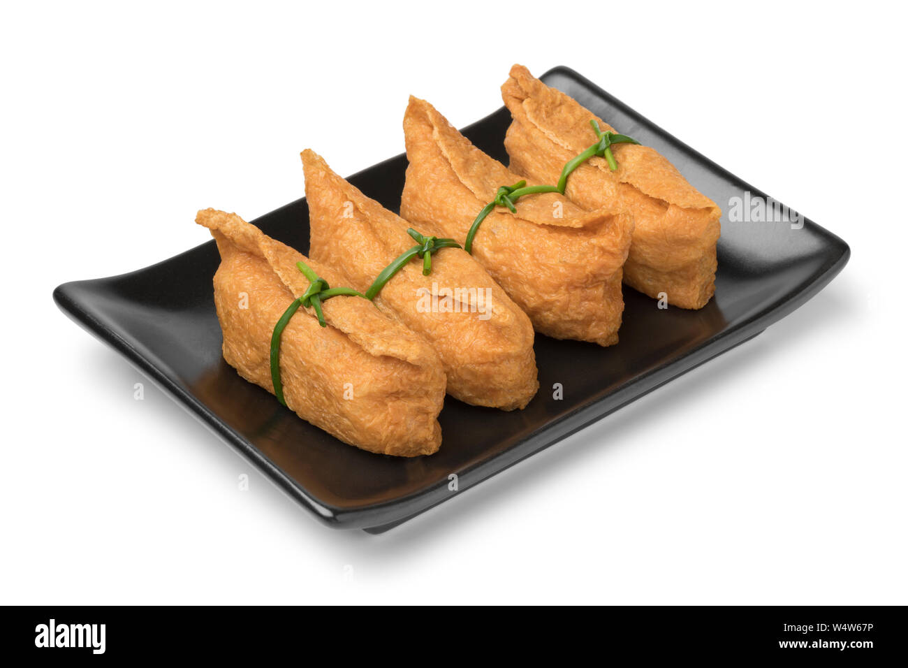 Dish with traditional Japanese fried marinated tofu stuffed with rice
