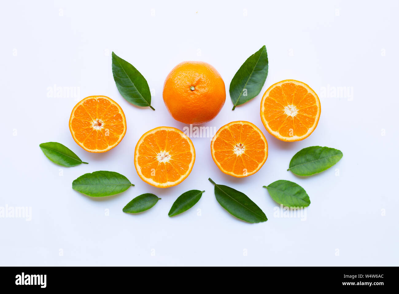 High vitamin C. Fresh orange citrus fruit with leaves isolated on white