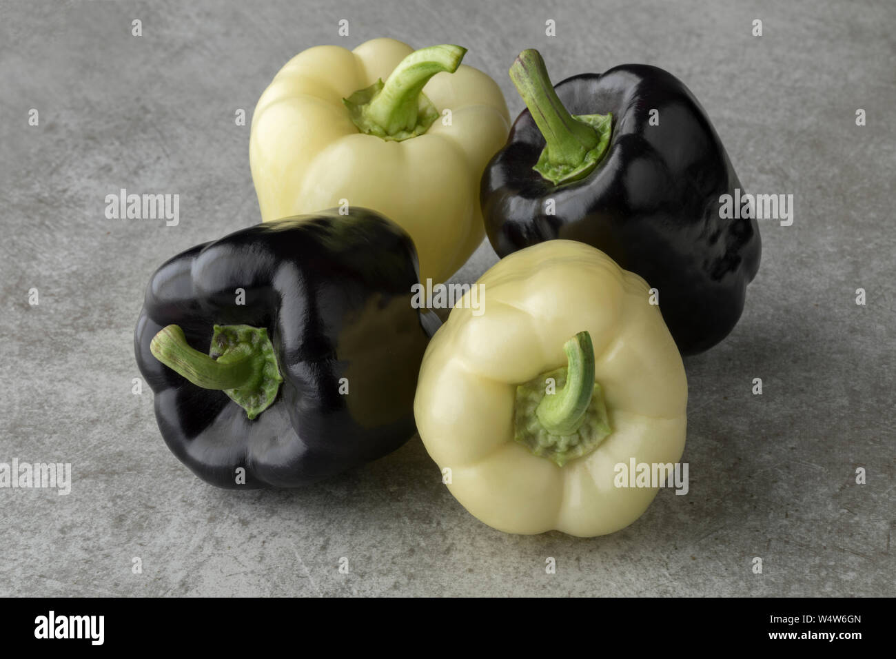Fresh raw purple and white bell peppers Stock Photo