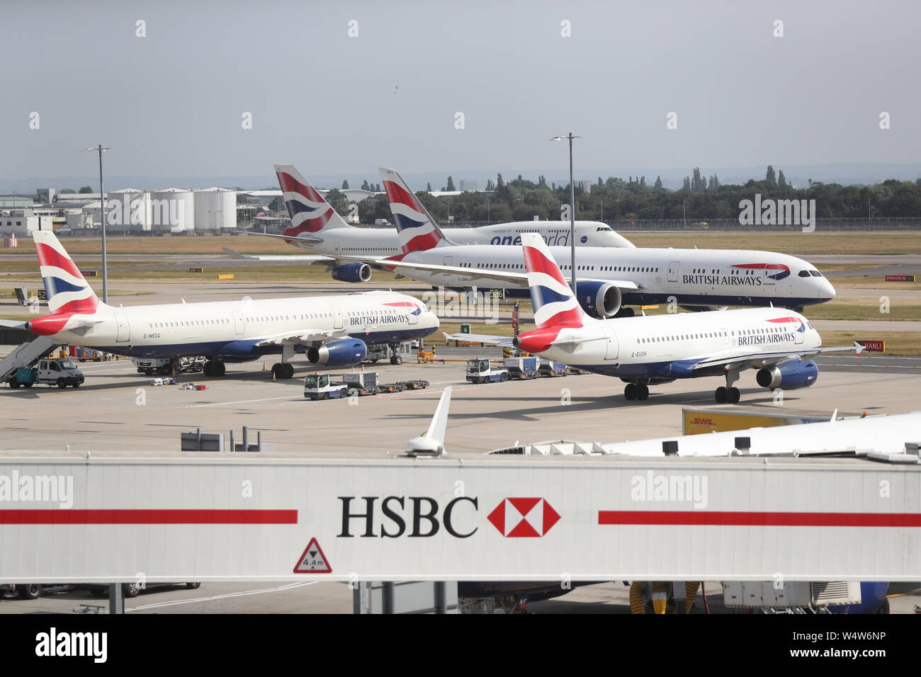 Planes on the runway at Heathrow airport. The UK has surpassed the hottest July day on record, with 36.9 degrees celsius at Heathrow being recorded. The UK's all-time record of 38.5 degrees may be broken later this afternoon. Stock Photo