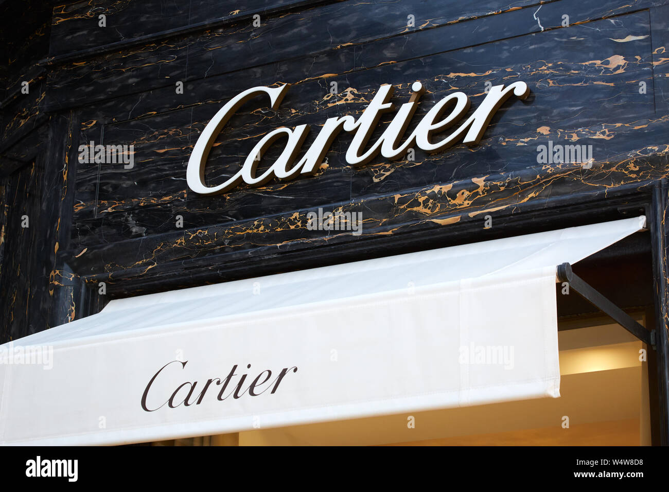 MONTE CARLO, MONACO - AUGUST 19, 2016: Cartier jewelry luxury store sign and black marble background in Monte Carlo, Monaco. Stock Photo