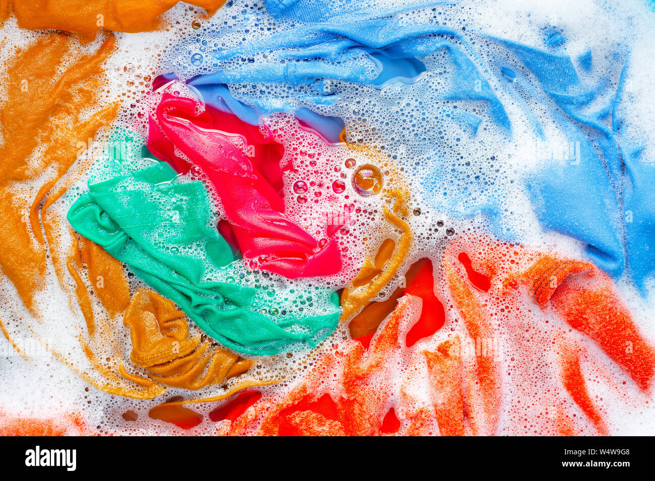 Color clothes soak before washing. Top view Stock Photo - Alamy