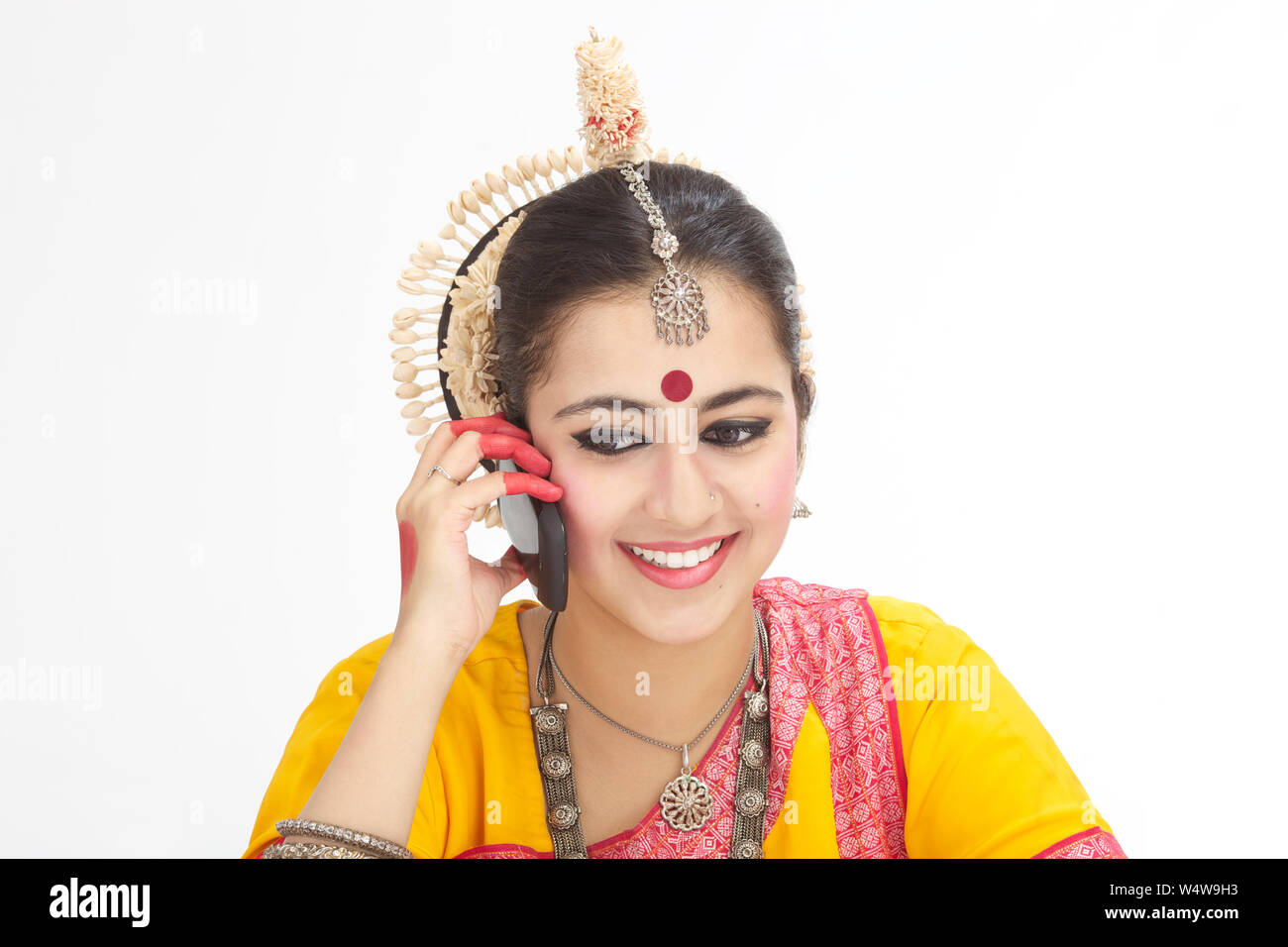 Indian young woman talking on a mobile phone Stock Photo - Alamy