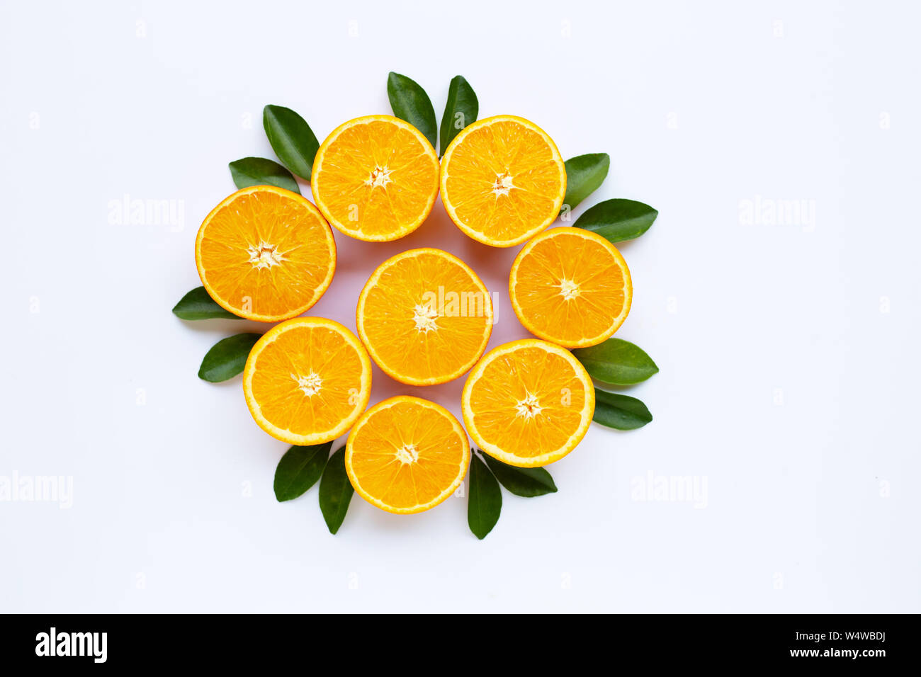 High vitamin C. Fresh orange citrus fruit with leaves isolated on white