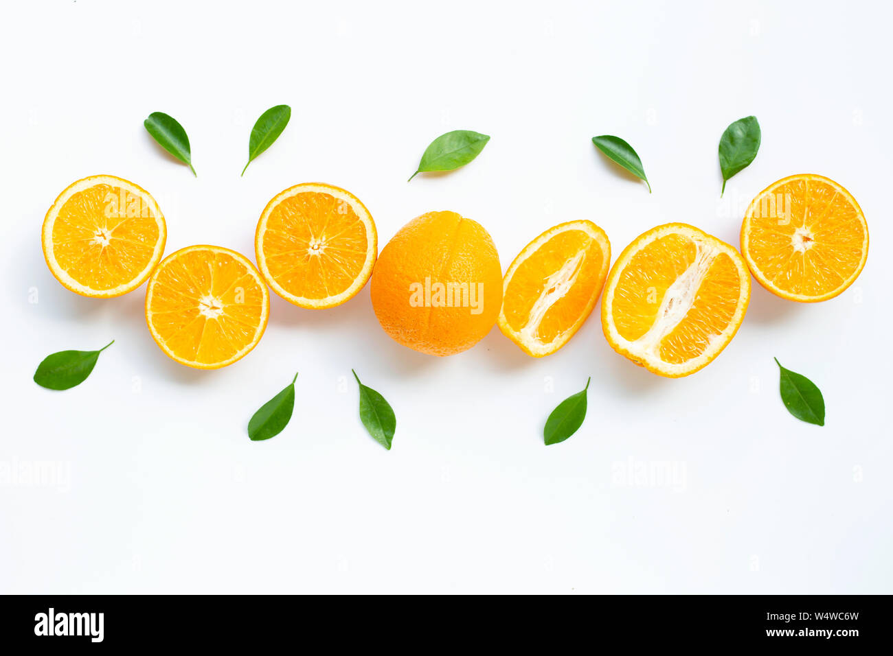 High vitamin C. Fresh orange citrus fruit with leaves isolated on white