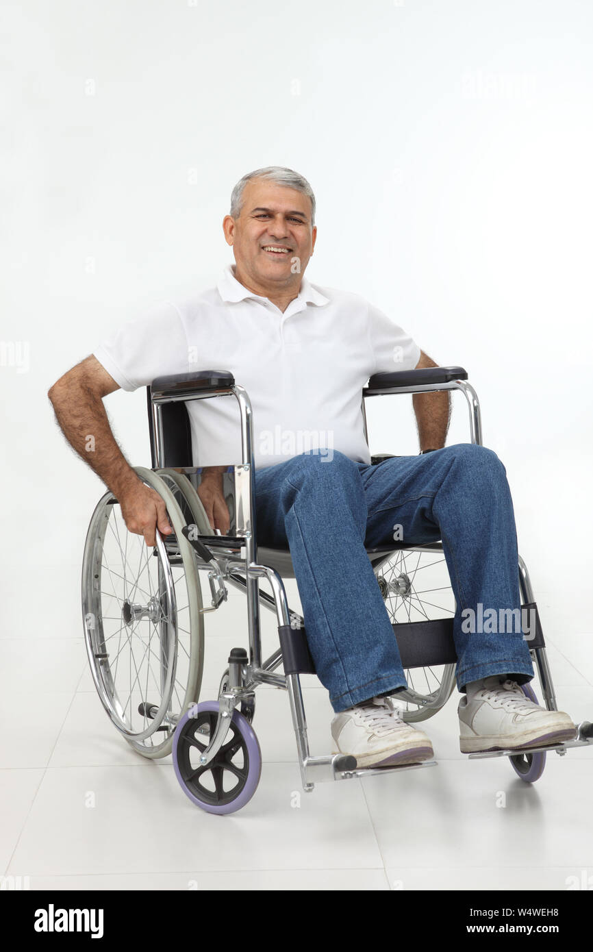 Old man sitting in a wheelchair and smiling Stock Photo - Alamy