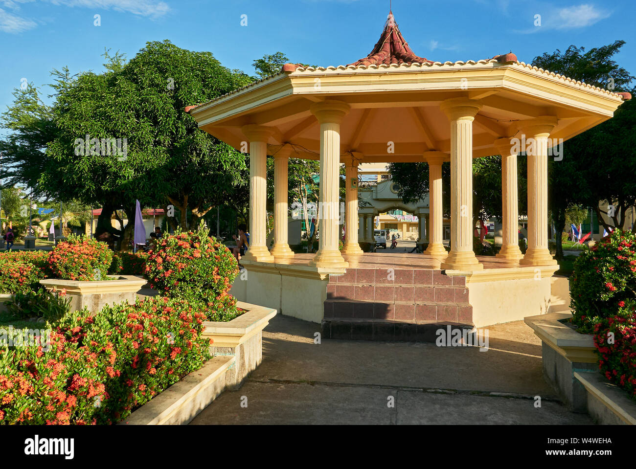 Spanish style pavilion, surrounded by flowers and trees at the town