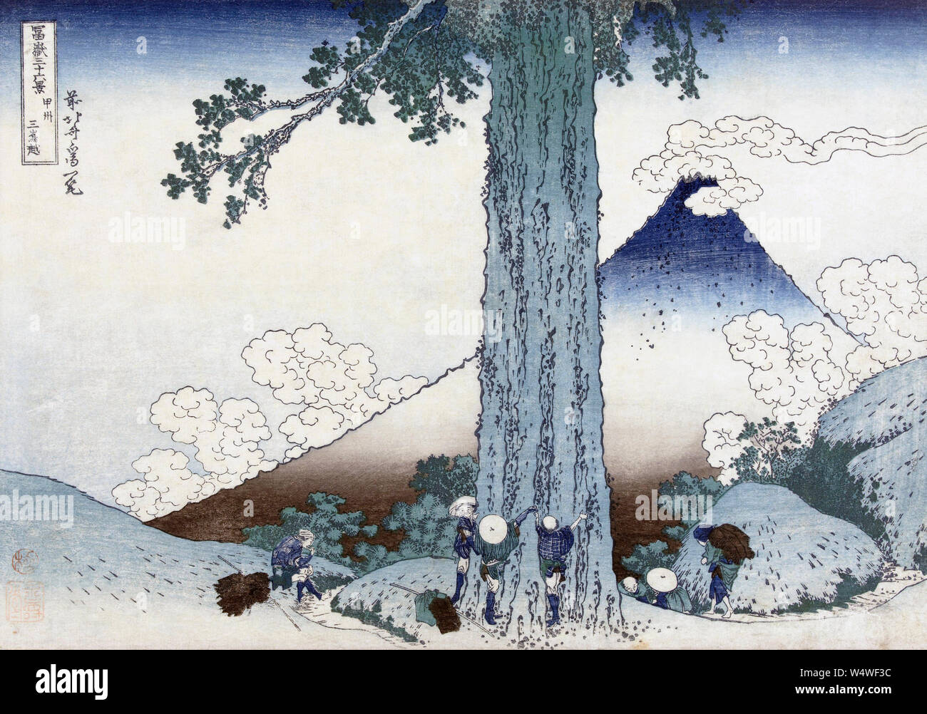 Mishima mountain pass in Kai province,  Japan, showing Mt Fuji.  After a woodblock print dating from circa 1830 by Japanese artist Katsushika Hokusai, 1760 - 1849.  The woodblock is part of a series known as Thirty-six Views of Mount Fuji. Stock Photo