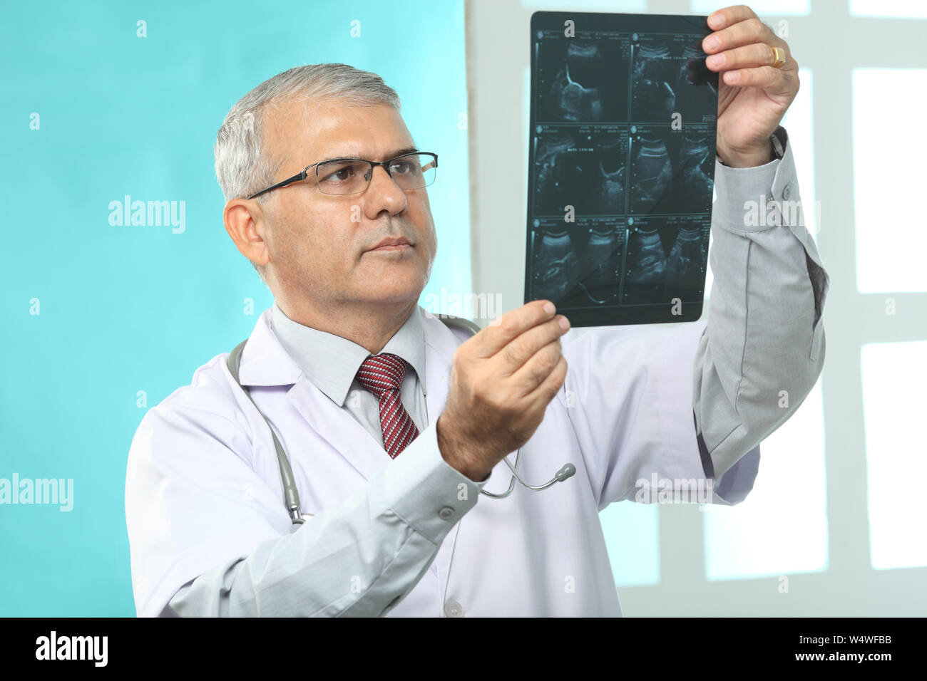 Indian doctor holding x ray hi-res stock photography and images - Alamy