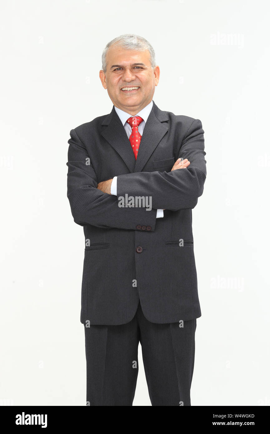 Businessman smiling with his arms crossed Stock Photo - Alamy