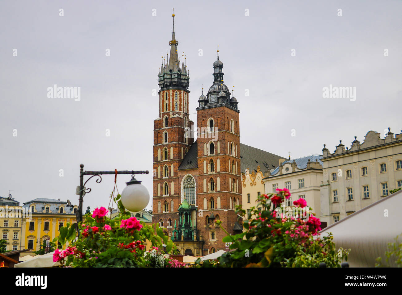 Krakow, Poland - May 21, 2019: View of flowers in the foreground, in the background the church is out of focus Stock Photo