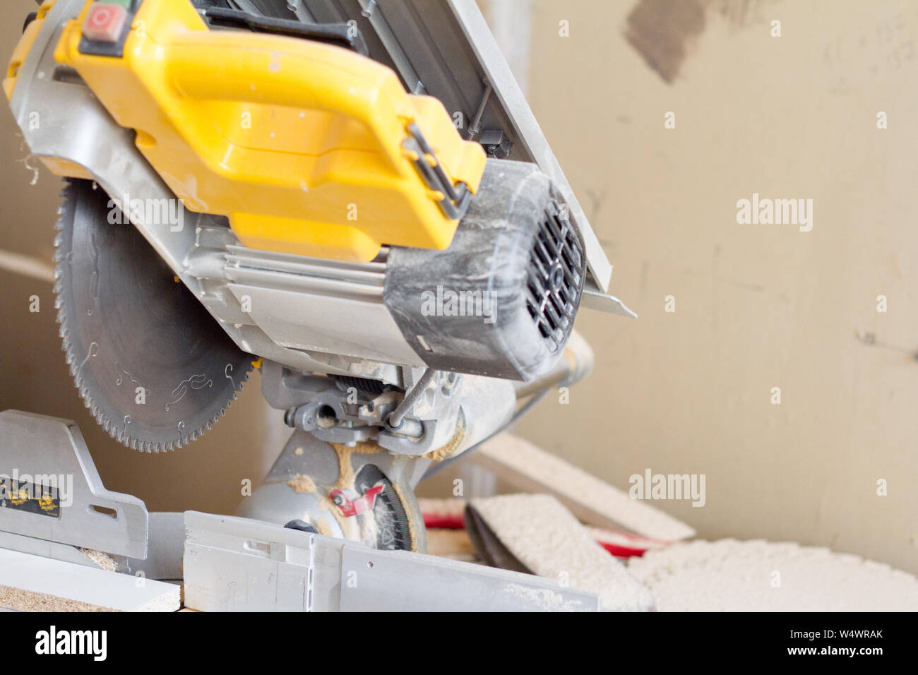 Closeup stationary circular saw on a carpentry table on a blurred