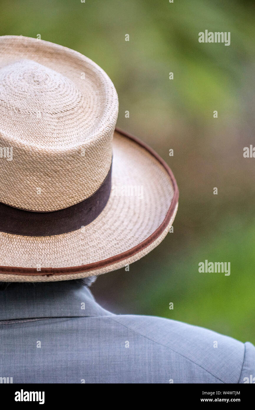 A man wearing a wide brimmed straw hat. Stock Photo