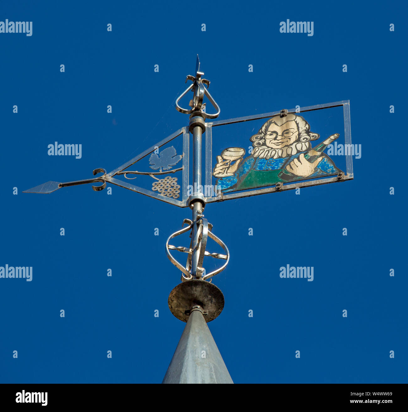 Comical wind vane on top of wine store in Bernkastel Stock Photo Alamy