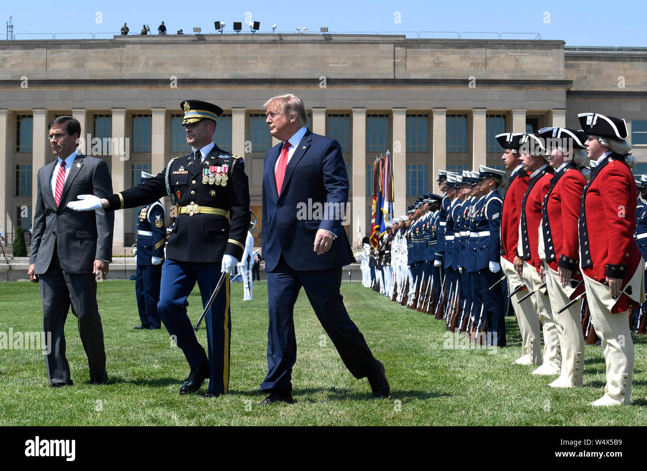 United States President Donald J. Trump (L) concludes a review of troops with the new US Secretary of Defense Dr. Mark T. Esper (R) and US Air Force General Paul J. Selva, Vice Chairman of the Joint Chiefs of Staff, at the Pentagon, Thursday, July 25, 2019, Washington, DC. The Department of Defense has been without a full-time leader since former Secretary Jim Mattis resigned in December 2018. Credit: Mike Theiler/Pool via CNP /MediaPunch Stock Photo
