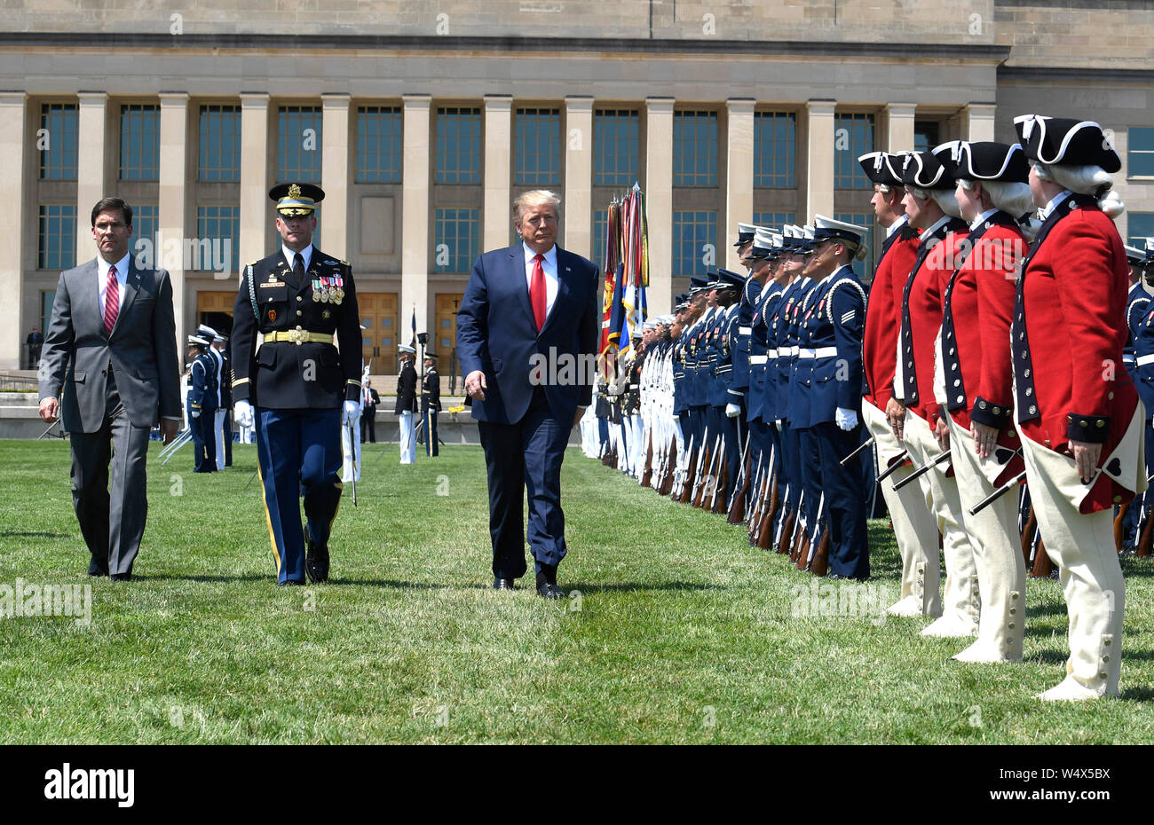 United States President Donald J. Trump (R) reviews troops with the new US Secretary of Defense Dr. Mark T. Esper (L) and US Air Force General Paul J. Selva, Vice Chairman of the Joint Chiefs of Staff, at the Pentagon, Thursday, July 25, 2019, Washington, DC. The Department of Defense has been without a full-time leader since former Secretary Jim Mattis resigned in December 2018. Credit: Mike Theiler/Pool via CNP /MediaPunch Stock Photo