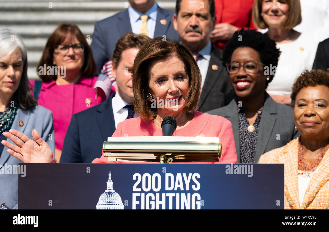 U.S Representative Nancy Pelosi (D-CA) speaking at a press event with House Democrats on the first 200 days of the 116th Congress, on the steps of the Capitol in Washington, DC. Stock Photo