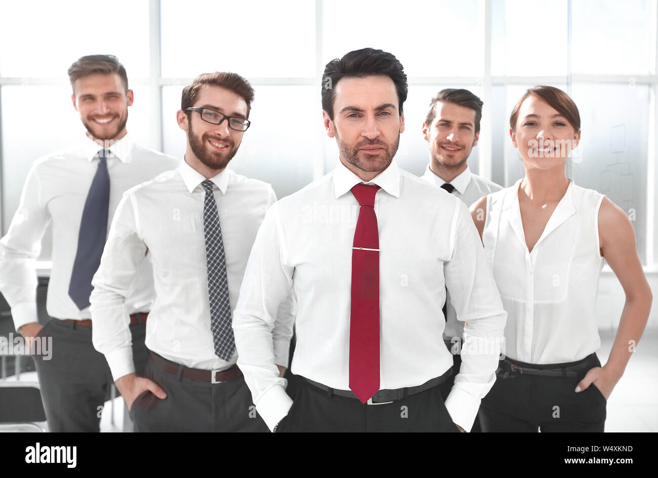 businessman standing in front of his business team Stock Photo - Alamy