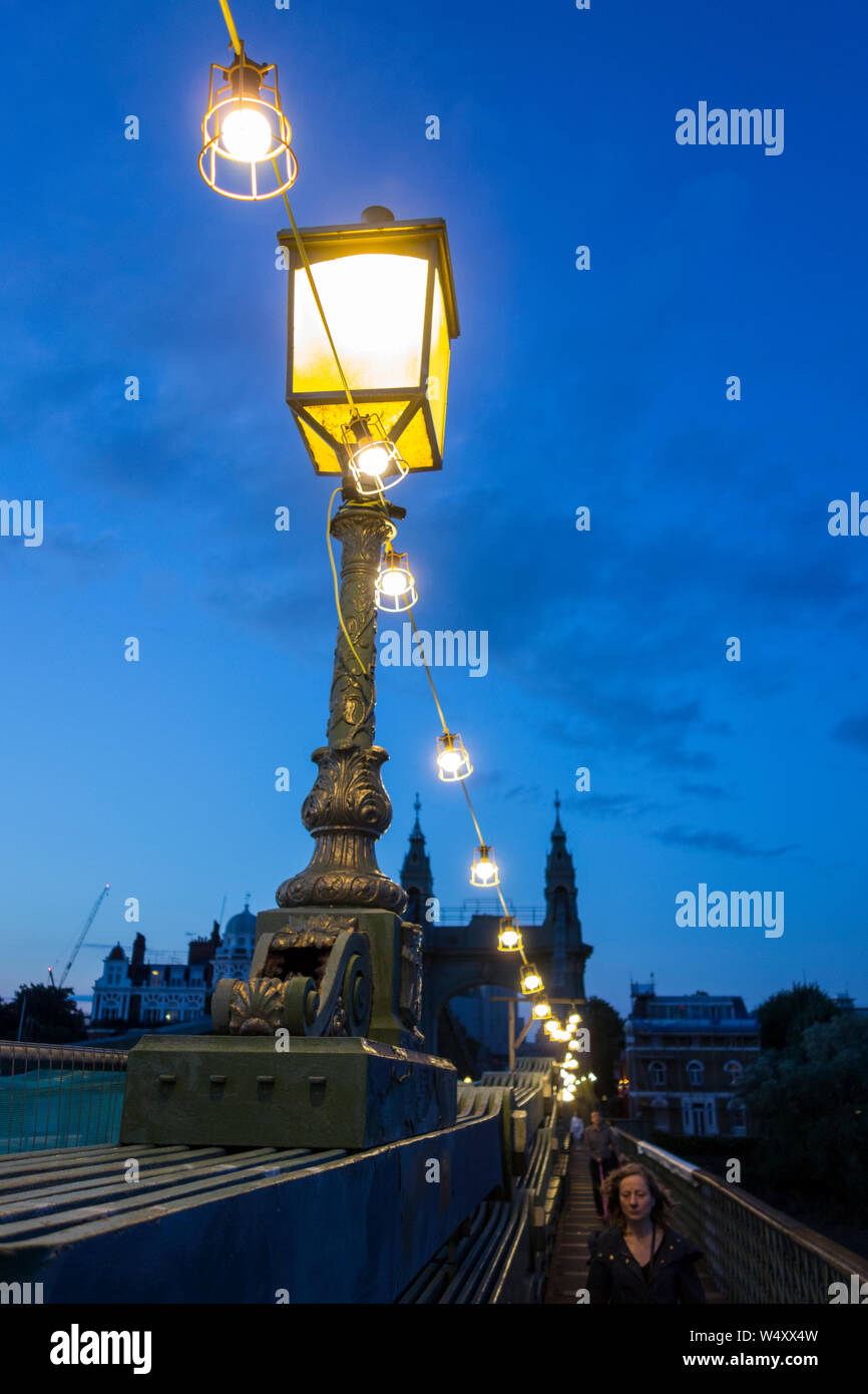 Street lamps on Hammersmith Bridge at night Stock Photo