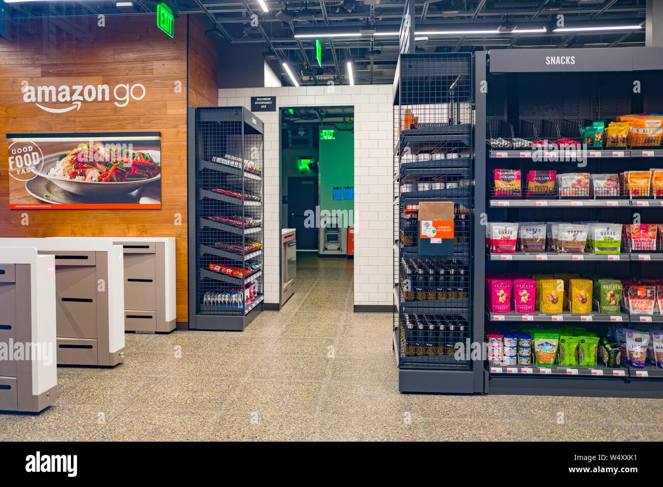 Empty interior with logo at Amazon Go concept store, a physical retail store operated by Amazon in which shoppers are able to take items from shelves and exit without a checkout process, having their items automatically charged to their Amazon Prime account, San Francisco, California; the store uses advanced machine vision and artificial intelligence technologies to automatically record purchases, December 25, 2018. () Stock Photo