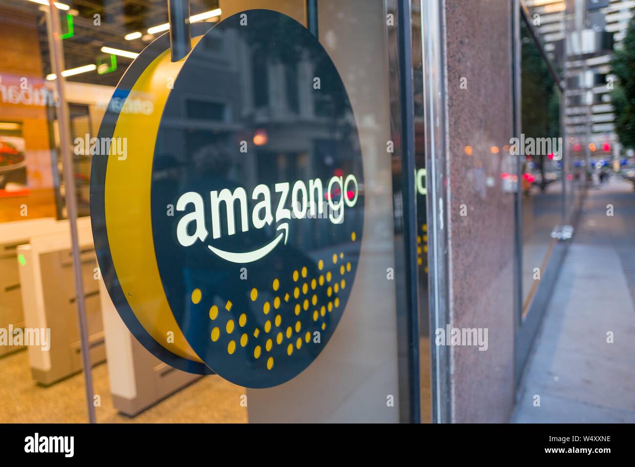 Facade with logo and sign at the Amazon Go concept store, a physical retail  store operated by Amazon in which shoppers are able to take items from  shelves and exit without a