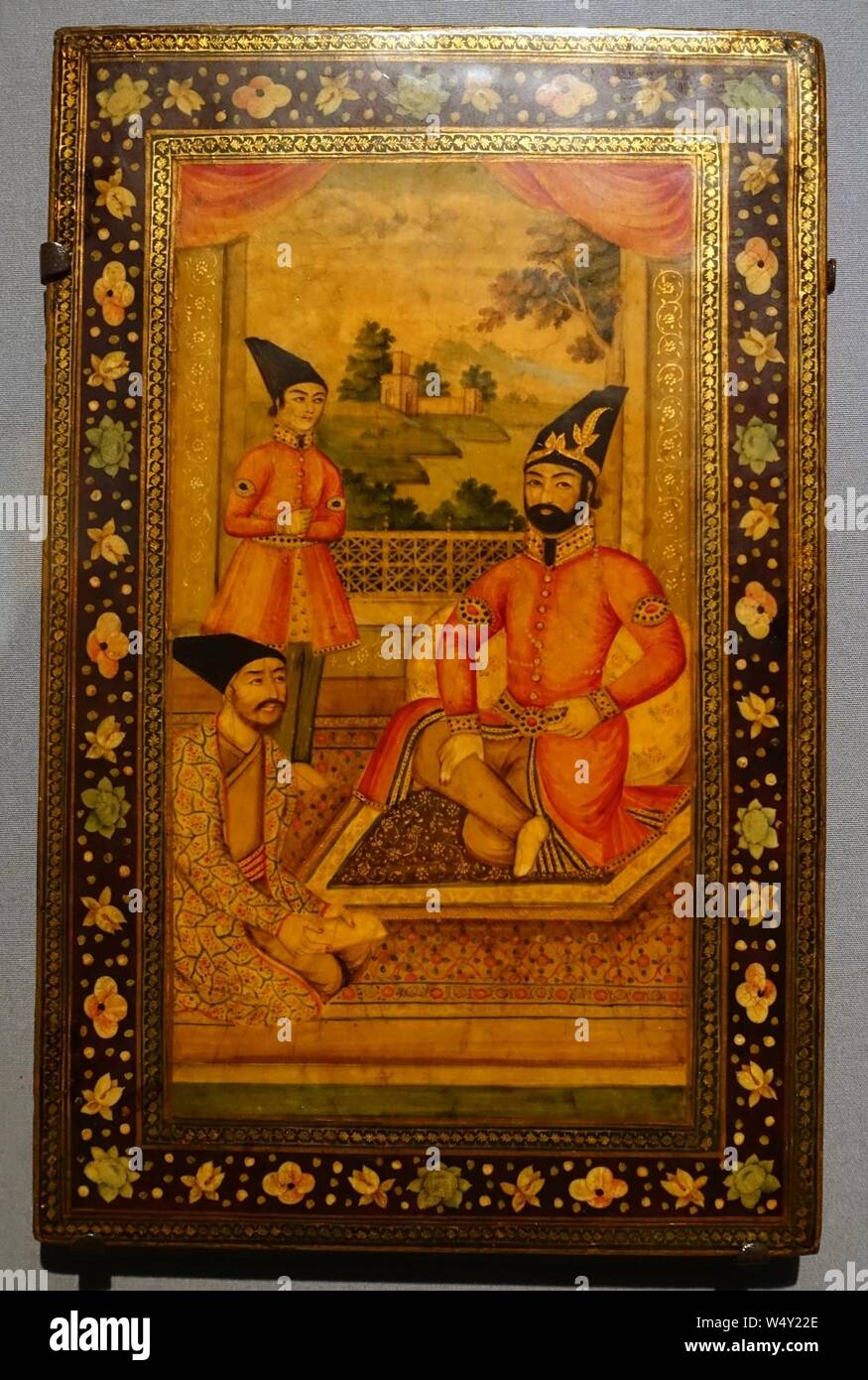 Cover of a mirror case with Muhammad Shah, Prince Nasir al-Din, and Haji Mirza Aqasi, Iran, c. 1835-1840 AD, watercolor, gold-colored pigments, and lacquer on pasteboard- Stock Photo