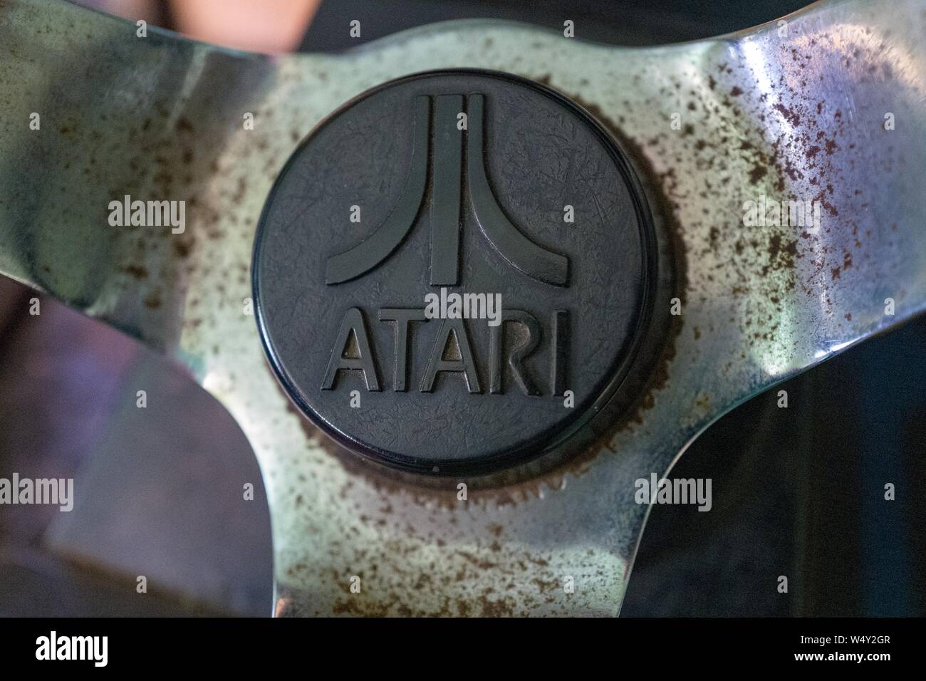 Close-up of logo for video and arcade game manufacturer Atari on a 1980s era arcade game console, April 12, 2019. () Stock Photo