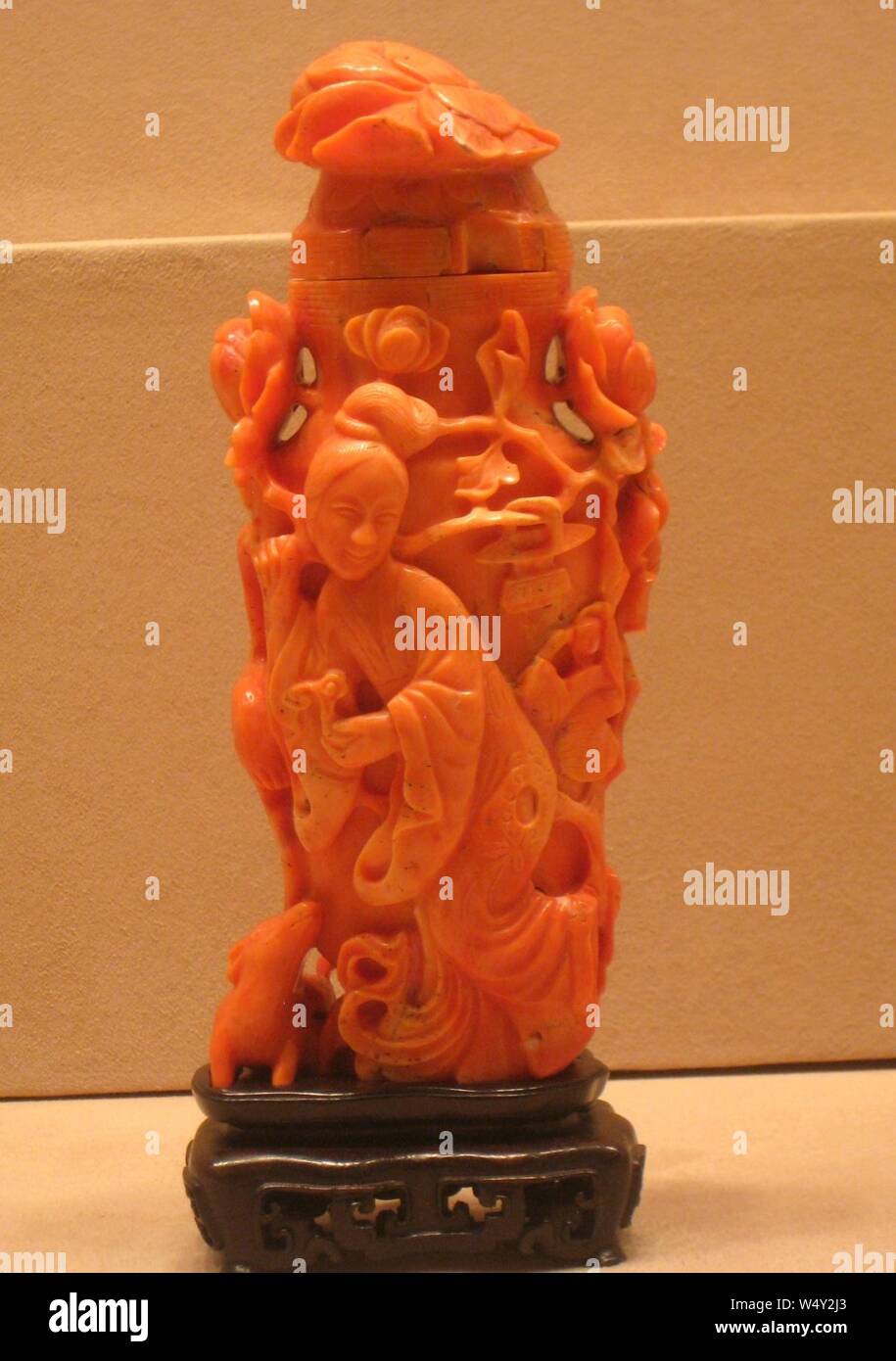 Covered Vase Decorated with Female Figure Holding Lingzhi Fungus and Peony Branch, Accompanied by a Boy, a Crane, and a Deer, China, Qing dynasty, 18th century, coral - Stock Photo