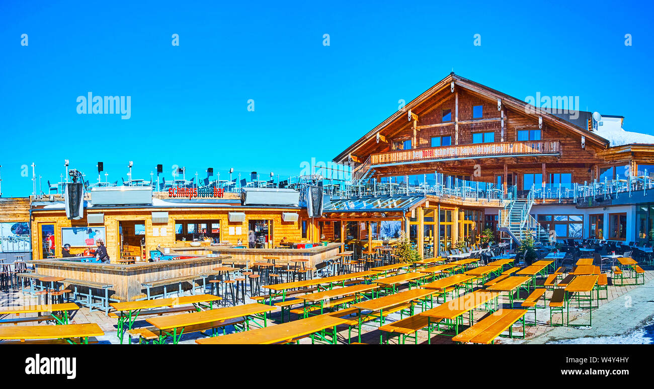 ZELL AM SEE, AUSTRIA - FEBRUARY 28, 2019: Panorama of the wooden lounge bar with large open air terrace, located on the top of Schmitten mount - famou Stock Photo