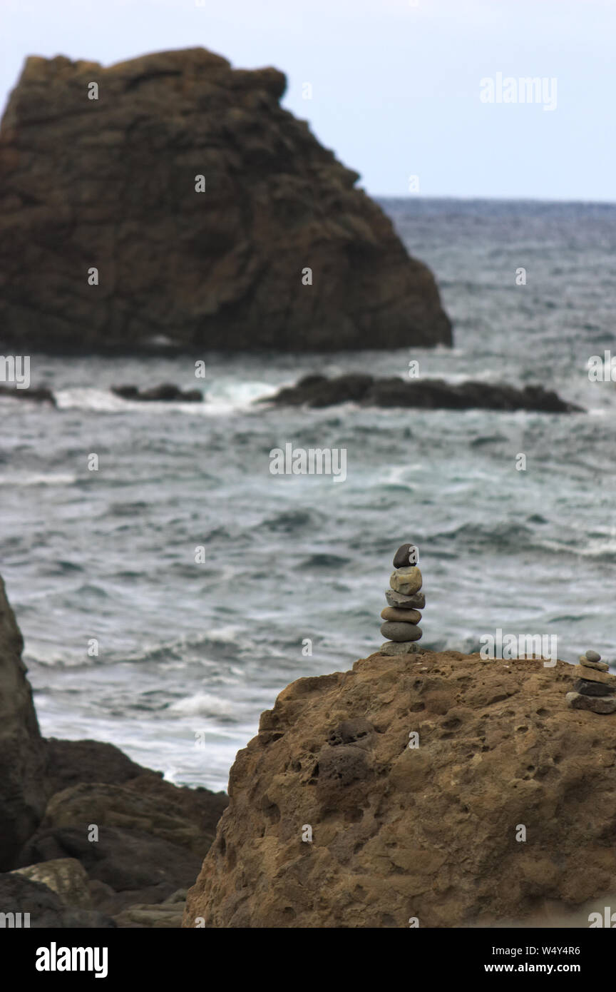 Stacked Rocks at the beach stock photo. Image of tranquility - 193330730